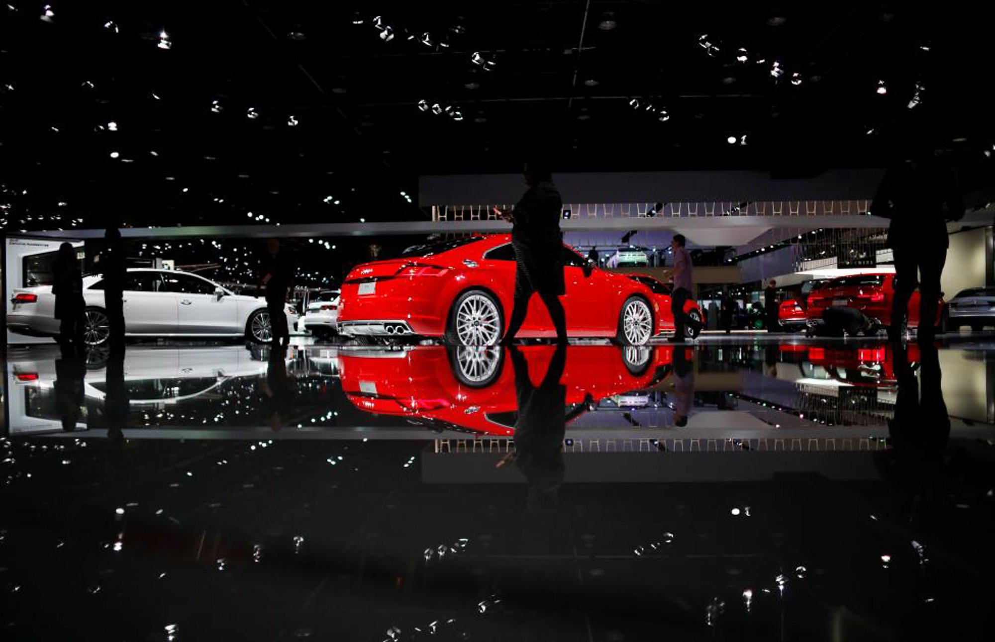 People walk by the Audi display. PHOTO: REUTERS