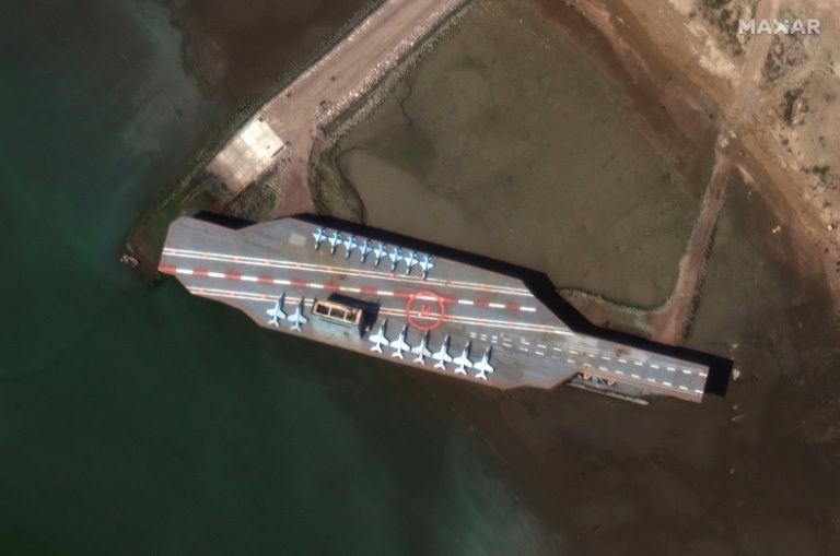 a previous iranian naval exercise near the strategic strait of hormuz in july drew condemnation from washington when missiles blasted a us aircraft carrier mock up seen here in a satellite image obtained courtesy of maxar technologies more