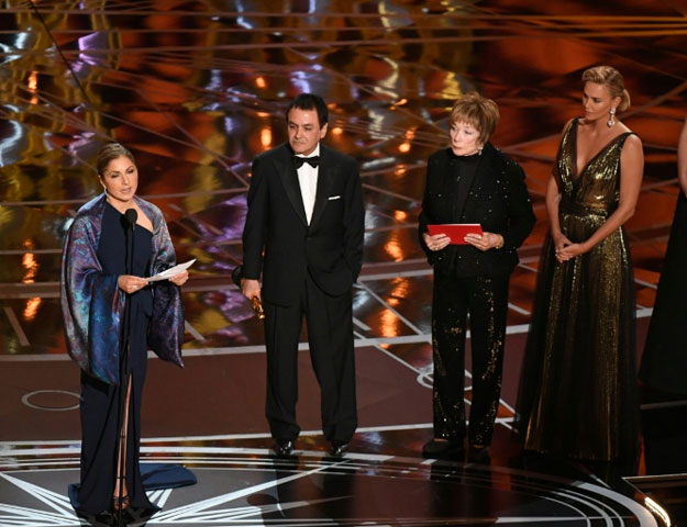 AFP / Mark RALSTONIranian-US engineer Anousheh Ansari (L) delivers a speech on behalf of Iranian director Asghar Farhadi while accepting the Oscar for Best Foreign Language Film for 