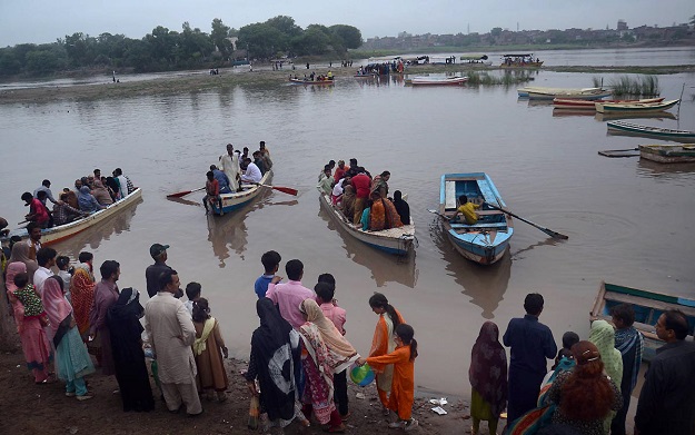People taking boat ride in River Ravi. PHOTO: Sajid Rana