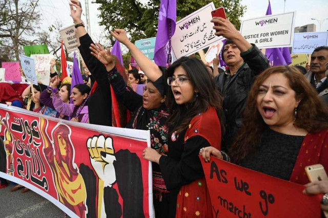 pakistani civil society activists carry placard and shout slogans during a rally for women rights on international women s day in islamabad photo afp pakistani civil society activists carry placard and shout slogans during a rally for women rights on international women s day in islamabad photo afp