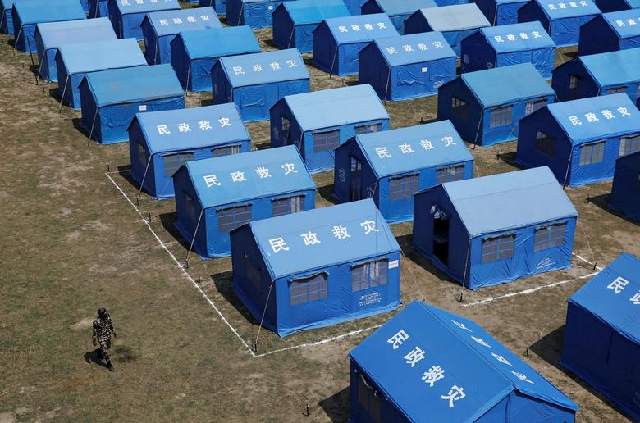 Personnel walks near a model quarantine zone at the Nepalese Army headquarters amid concerns about the spread of coronavirus in Kathmandu, Nepal. PHOTO: Reuters