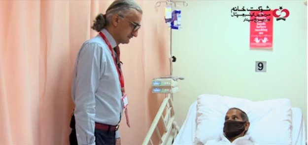 Dr Aasim Yusuf, the Chief Medical Officer of SKMCH&RC on a round, inquiring about the health of a patient undergoing chemotherapy in the adult section of the Outpatient Chemotherapy Bay. The patient has been receiving treatment at SKMCH&RC for over a year and even during the ongoing pandemic, his treatment has continued without any interruption