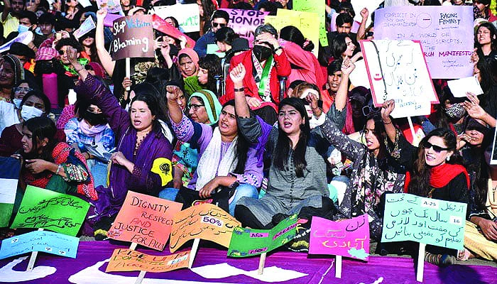 women hold placards at aurat march karachi 2024 photo file women hold placards at aurat march karachi 2024 photo file