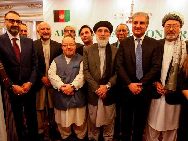 afghan delegates pose with pakistan 039 s foreign minister shah mehmood qureshi second from right ahead of a peace conference in bhurban on june 22 2019 photo afp