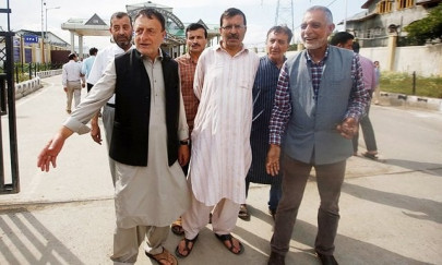 iok police arrest newspaper publisher in midnight raid