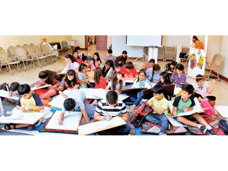 students draw during a summer art camp photo express