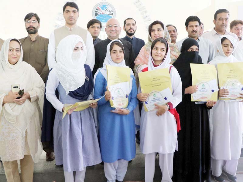 position holders pose with certificates photo online