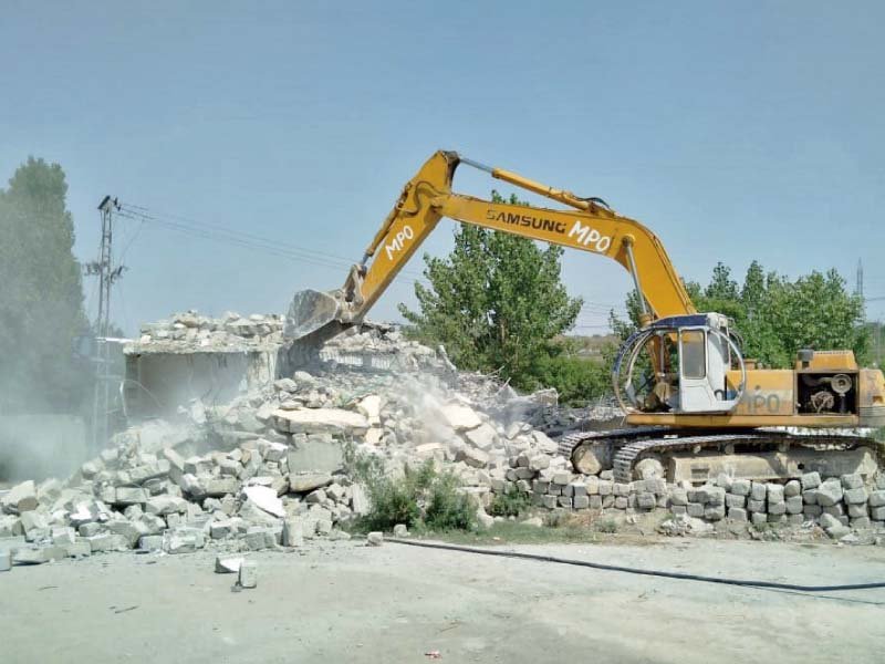 cda clears rubble of demolished buildings in sector g 12