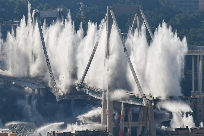 explosive charges blow up the eastern pylons of genoa 039 s morandi motorway bridge photo afp