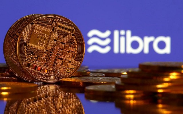 representations of virtual currency are displayed in front of the libra logo in this illustration picture june 21 2019 photo reuters
