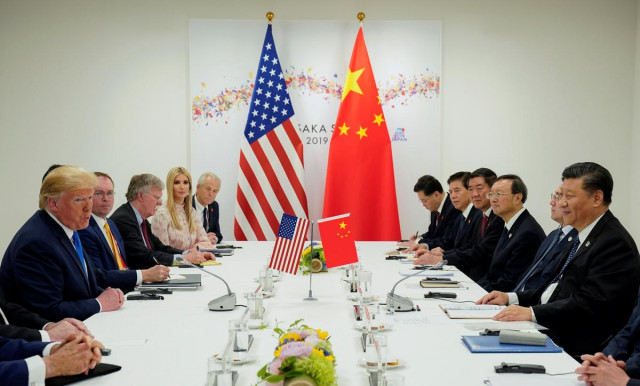 trump says he will not lift existing tariffs but will refrain from slapping new levies photo reuters trump says he will not lift existing tariffs but will refrain from slapping new levies photo reuters