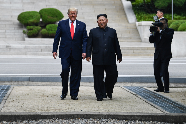 north korea 039 s leader kim jong un walks with us president donald trump north of the military demarcation line that divides north and south korea in the joint security area jsa of panmunjom in the demilitarized zone dmz on june 30 2019 photo afp
