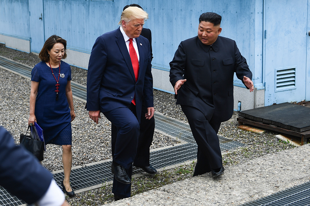 north korea 039 s leader kim jong un and us president donald trump walk together south of the military demarcation line that divides north and south korea after trump briefly stepped over to the northern side in the joint security area jsa of panmunjom in the demilitarized zone dmz on june 30 2019 photo afp