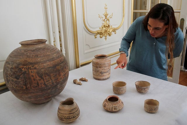 archaeologist aurore didier points to some artifacts amongst the 445 artifacts from the 2nd and 3rd millennium bc which were seized by french customs between 2006 and 2007 before being returned by french authorities to pakistan during a ceremony at the embassy of pakistan in paris france july 2 2019 photo reuters archaeologist aurore didier points to some artifacts amongst the 445 artifacts from the 2nd and 3rd millennium bc which were seized by french customs between 2006 and 2007 before being returned by french authorities to pakistan during a ceremony at the embassy of pakistan in paris france july 2 2019 photo reuters