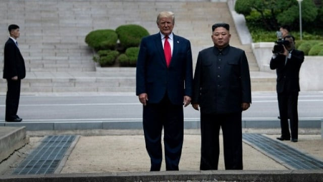 trump and north korea 039 s leader kim jong un stand on north korean soil while walking to south korea in the demilitarized zone dmz on june 30 2019 in panmunjom korea photo afp trump and north korea 039 s leader kim jong un stand on north korean soil while walking to south korea in the demilitarized zone dmz on june 30 2019 in panmunjom korea photo afp