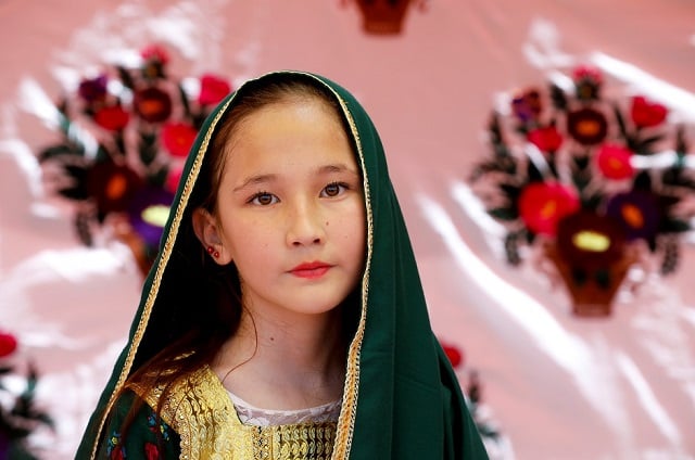 a hazara girl poses for a photograph during the hazara culture day photo reuters