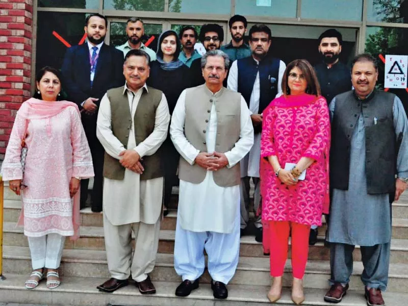minister for education and professional training shafqat mehmood with comsats faculty photo express minister for education and professional training shafqat mehmood with comsats faculty photo express