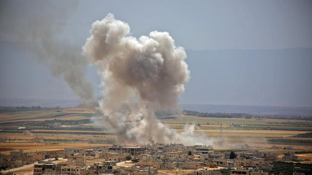 plumes of smoke rise after syrian government forces 039 bombardment on the town of khan sheikhoun in southern idlib photo afp