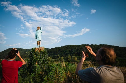 rustic sculpture of melania trump unveiled near slovenian hometown