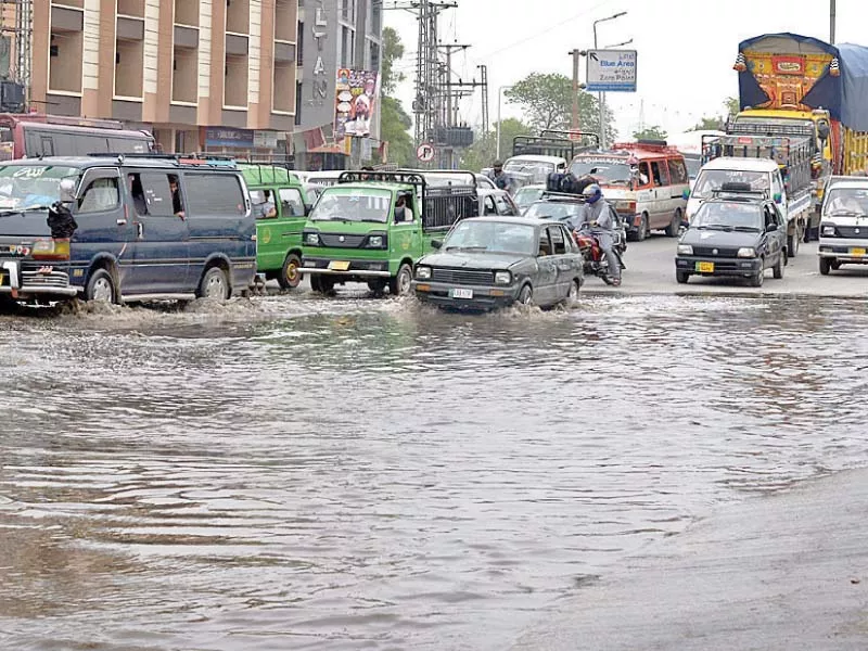 vehicles pass through stagnant rainwater at faizabad photo online vehicles pass through stagnant rainwater at faizabad photo online