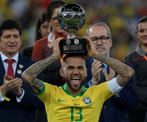 brazil 039 s dani alves poses with his trophy for best player of the copa america after defeating peru in the final match of the football tournament at maracana stadium photo afp brazil 039 s dani alves poses with his trophy for best player of the copa america after defeating peru in the final match of the football tournament at maracana stadium photo afp