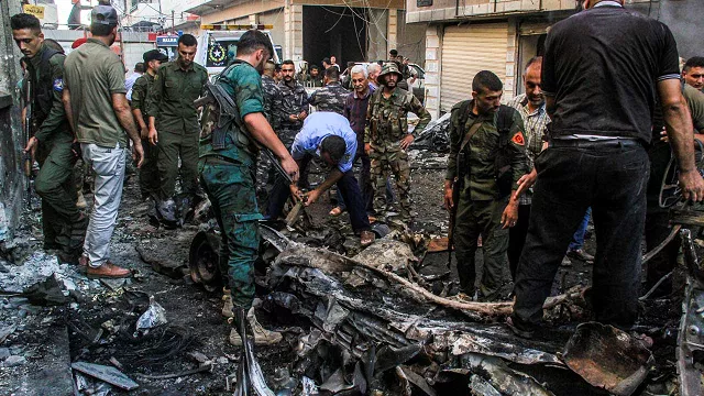 syrian kurdish security forces inspect the wreckage of a rigged car which detonated outside the syriac orthodox church of the virgin mary in the predominantly christian neighbourhood of al wasti in the kurdish majority city of qamishli in northeast syria on july 11 2019 photo afp syrian kurdish security forces inspect the wreckage of a rigged car which detonated outside the syriac orthodox church of the virgin mary in the predominantly christian neighbourhood of al wasti in the kurdish majority city of qamishli in northeast syria on july 11 2019 photo afp