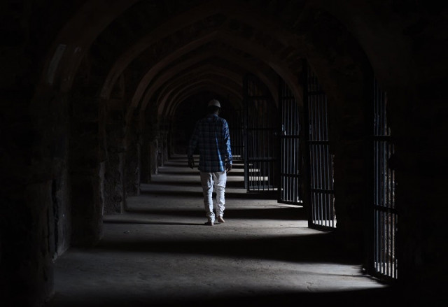 an indian muslim devotee after offering prayers photo afp an indian muslim devotee after offering prayers photo afp