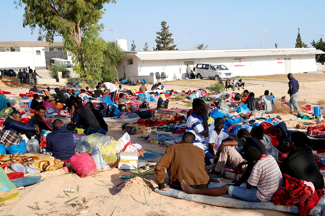 migrants are seen with their belongings in the yard of a detention centre for mainly african migrants hit by an air strike in the tajoura suburb of tripoli libya july 3 2019 photo reuters migrants are seen with their belongings in the yard of a detention centre for mainly african migrants hit by an air strike in the tajoura suburb of tripoli libya july 3 2019 photo reuters