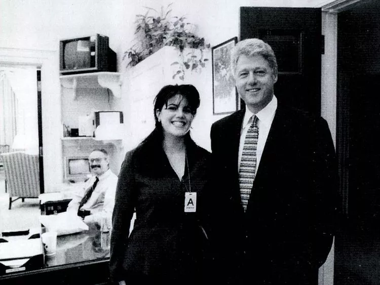 a photograph showing former white house intern monica lewinsky meeting president bill clinton at a white house function submitted as evidence in documents by the starr investigation and released by the house judicary committee september 21 1998 afp file a photograph showing former white house intern monica lewinsky meeting president bill clinton at a white house function submitted as evidence in documents by the starr investigation and released by the house judicary committee september 21 1998 afp file
