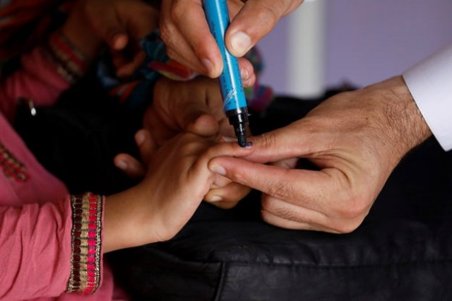 a girl gets her finger marked after she is administered polio vaccine drops at a civil dispensary in peshawar on july 11 2019 photo reuters a girl gets her finger marked after she is administered polio vaccine drops at a civil dispensary in peshawar on july 11 2019 photo reuters