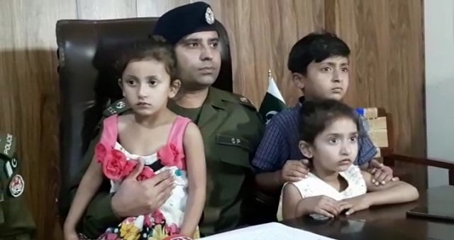sp saddar division rae mazhar poses with the three children photo express sp saddar division rae mazhar poses with the three children photo express
