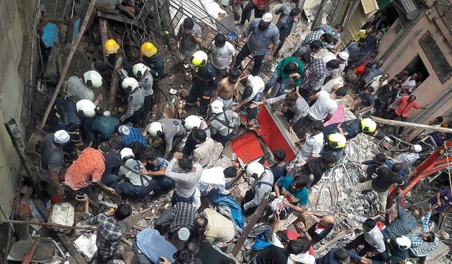 rescue workers and residents search for survivors at the site of a collapsed building photo reuters rescue workers and residents search for survivors at the site of a collapsed building photo reuters