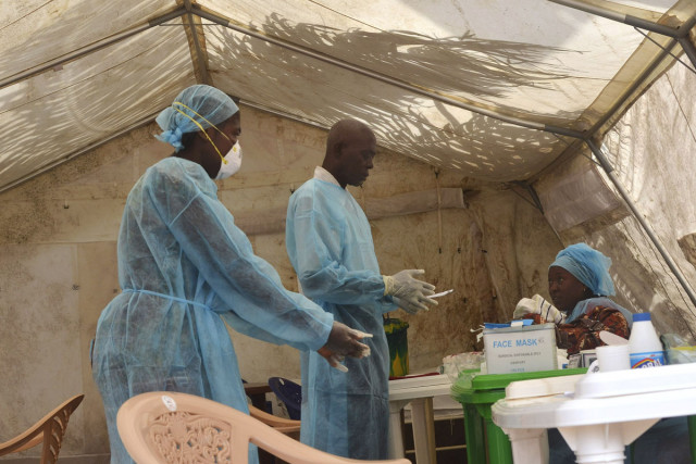 health workers take blood samples for ebola virus testing at a screening tent photo reuters health workers take blood samples for ebola virus testing at a screening tent photo reuters