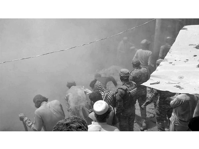 locals and rescue officials work to pull bodies of eight people who were buried when the roof of a house collapsed in orakzai tribal district photo online locals and rescue officials work to pull bodies of eight people who were buried when the roof of a house collapsed in orakzai tribal district photo online
