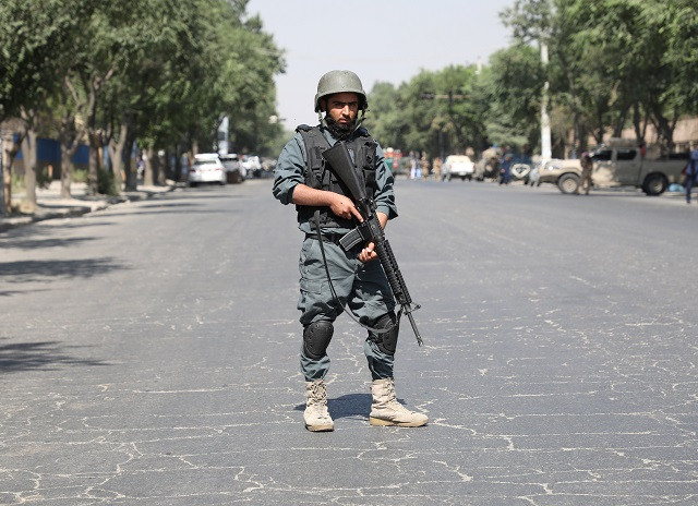 an afghan policeman keeps watch at the site of a blast near kabul university in kabul photo reuters an afghan policeman keeps watch at the site of a blast near kabul university in kabul photo reuters