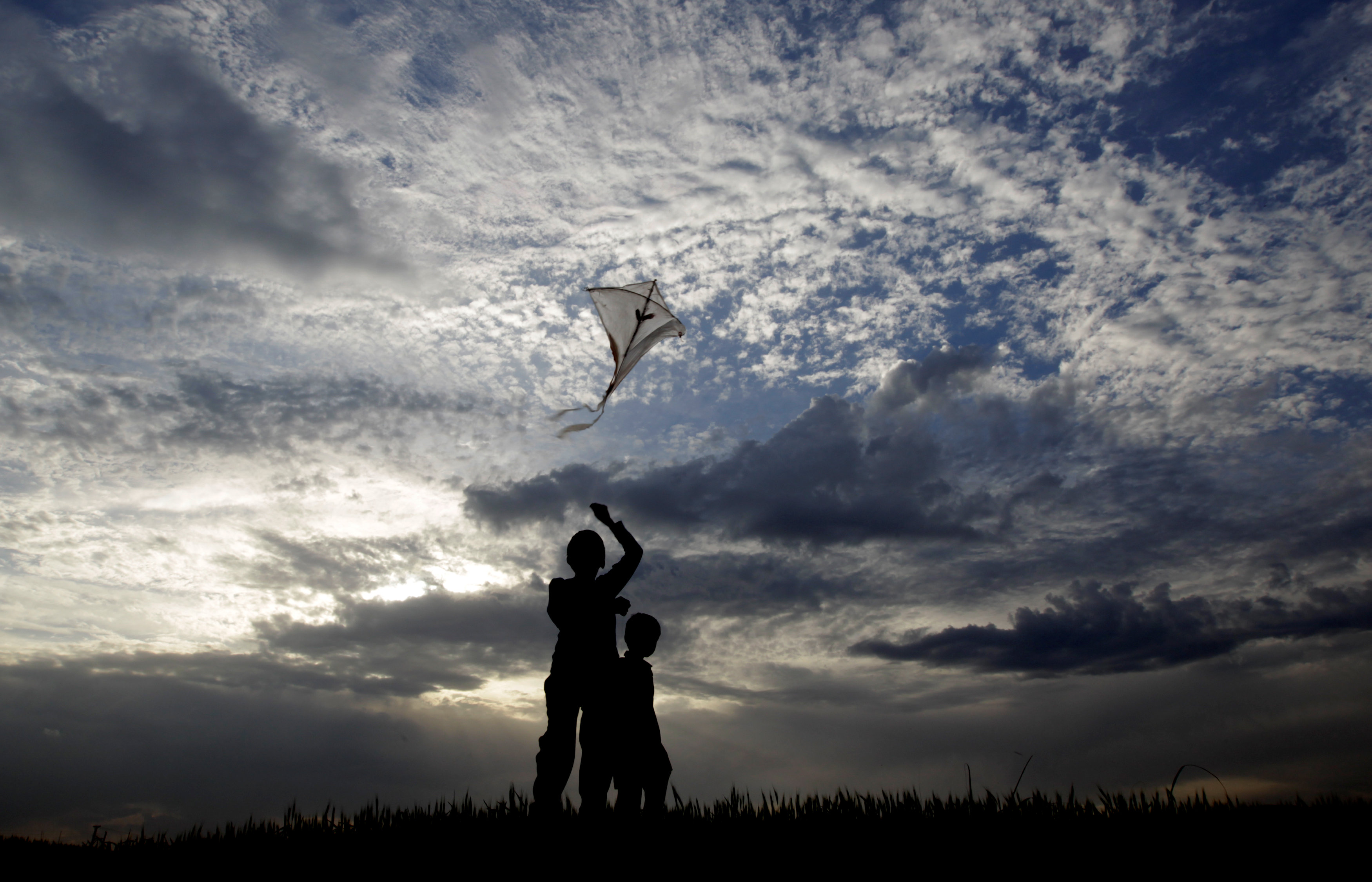 children fly a kite in islamabad photo reuters
