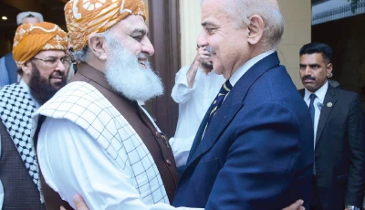 jui f chief maulana fazlur rehman warmly welcomes prime minister shehbaz sharif upon his arrival at the former s residence in islamabad photo app