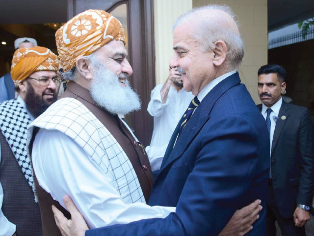 jui f chief maulana fazlur rehman warmly welcomes prime minister shehbaz sharif upon his arrival at the former s residence in islamabad photo app jui f chief maulana fazlur rehman warmly welcomes prime minister shehbaz sharif upon his arrival at the former s residence in islamabad photo app