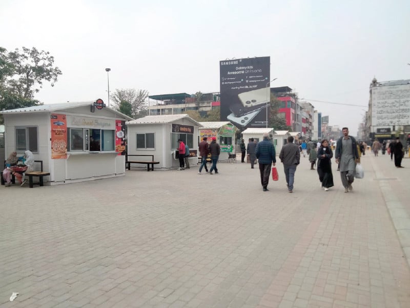 shoppers stroll along the newly revamped bank road in rawalpindi s saddar area which has been turned into a pedestrian only alley photo express