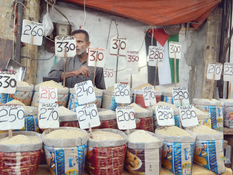 vendors display rates of commodities at the city s largest grain market the jodia bazaar photo express