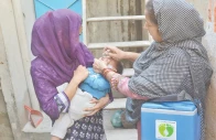 a health worker administers anti polio drops to a child marking the launch of the latest anti polio campaign in the city photo jalal qureshi express