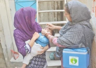 a health worker administers anti polio drops to a child marking the launch of the latest anti polio campaign in the city photo jalal qureshi express