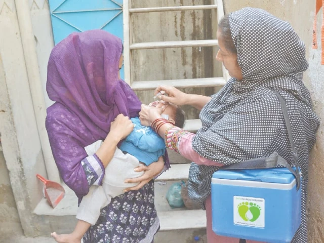 a health worker administers anti polio drops to a child marking the launch of the latest anti polio campaign in the city photo jalal qureshi express a health worker administers anti polio drops to a child marking the launch of the latest anti polio campaign in the city photo jalal qureshi express