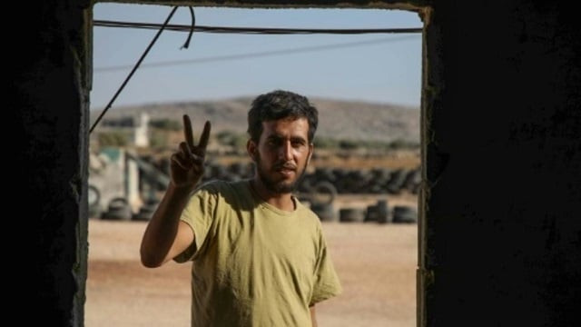 mohammad al naeemi a syrian who returned from exile in germany to join a rebel group flashes a victory sign at a training camp near the bab al hawa crossing between iblib province and turkey on july 18 2019 photo afp mohammad al naeemi a syrian who returned from exile in germany to join a rebel group flashes a victory sign at a training camp near the bab al hawa crossing between iblib province and turkey on july 18 2019 photo afp