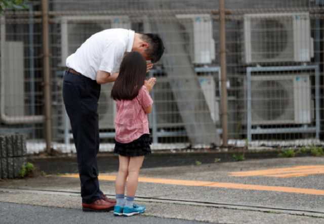father and daughter mourning the loss of victims in the japan attack photo reuters father and daughter mourning the loss of victims in the japan attack photo reuters