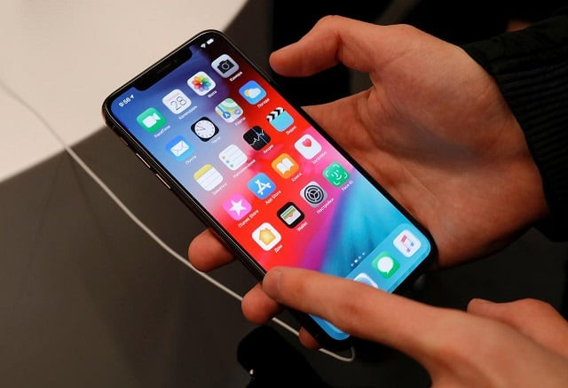 a customer tests a smartphone during the launch of the new iphone xs and xs max sales at quot re store quot apple reseller shop in moscow russia september 28 2018 photo reuters a customer tests a smartphone during the launch of the new iphone xs and xs max sales at quot re store quot apple reseller shop in moscow russia september 28 2018 photo reuters