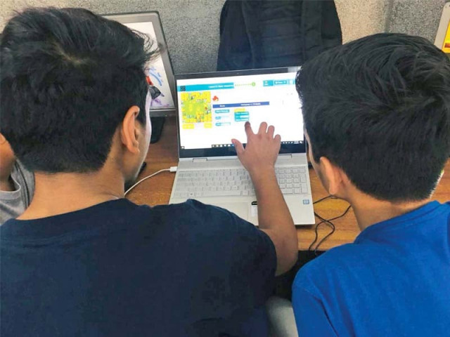 two children learn digital skills photo express two children learn digital skills photo express
