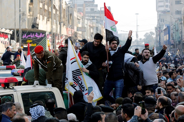 Mourners gesture as they attend the funeral of the Iranian Major-General Qassem Soleimani, top commander of the elite Quds Force of the Revolutionary Guards, and the Iraqi militia commander Abu Mahdi al-Muhandis, who were killed in an air strike at Baghdad airport, in Baghdad, Iraq. PHOTO: REUTERS