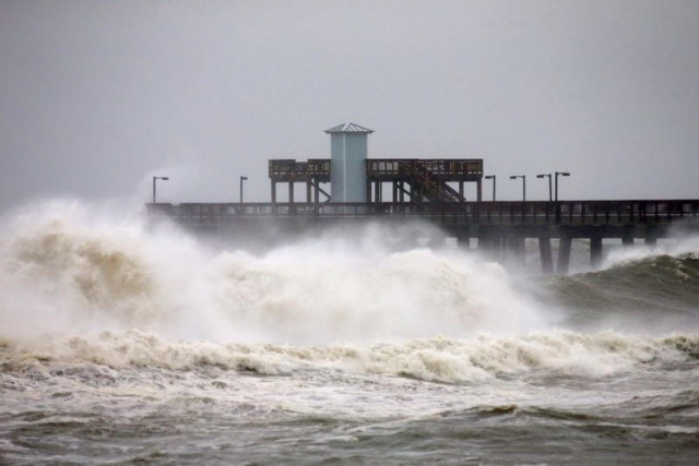 waves crash along a pier as hurricane sally approaches in gulf shores alabama u s september 15 2020 reuters waves crash along a pier as hurricane sally approaches in gulf shores alabama u s september 15 2020 reuters